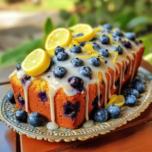 To make the lemon blueberry loaf, gather these ingredients: - 1 ½ cups all-purpose flour - 1 teaspoon baking powder - ½ teaspoon baking soda - ¼ teaspoon salt - ½ cup unsalted butter, at room temperature - ¾ cup granulated sugar - 2 large eggs, at room temperature - 1 teaspoon pure vanilla extract - 1 tablespoon fresh lemon zest - ½ cup fresh lemon juice - 1 ½ cups fresh blueberries (or frozen, if fresh are not available) For the glaze: - 1 cup powdered sugar - 2 tablespoons fresh lemon juice - 1 tablespoon fresh lemon zest Using fresh ingredients is key to a great lemon blueberry loaf. Fresh blueberries burst with flavor and moisture. You want each bite to taste bright and fruity. Fresh lemons add zing to your glaze. They also bring out the blueberries' sweetness. If you can, use fresh eggs and butter at room temperature. This helps create a smooth batter. Fresh ingredients make your loaf taste better and look more appealing. If you need to substitute, here are some ideas: - For gluten-free, use a 1:1 gluten-free flour blend. - If you don’t have unsalted butter, use salted butter. Just reduce the salt a bit. - You can replace granulated sugar with coconut sugar or honey. Adjust the other liquids if you use honey. - For a dairy-free option, try coconut oil or a dairy-free butter. - Substitute the blueberries with raspberries, strawberries, or blackberries for a fun twist. These swaps help keep the loaf tasty while meeting your needs. For the complete recipe, check the full recipe section. To start, gather your ingredients. Preheat your oven to 350°F (175°C). Grease a 9x5 inch loaf pan with butter and dust it with flour, or line it with parchment paper. This helps the loaf come out easily later. In a medium bowl, whisk together 1 ½ cups all-purpose flour, 1 teaspoon baking powder, ½ teaspoon baking soda, and ¼ teaspoon salt. This dry mix is essential for a good rise. Now, in a large bowl, cream together ½ cup unsalted butter and ¾ cup granulated sugar using an electric mixer. Mix until it’s light and fluffy, about 3 to 4 minutes. This step adds air to your batter, making it soft. Next, add 2 large eggs, one at a time. Beat well after each addition. Then, stir in 1 teaspoon pure vanilla extract, 1 tablespoon fresh lemon zest, and ½ cup fresh lemon juice. Mix until everything is well combined. Gradually add the dry mixture to the wet ingredients. Mix until just combined. Be careful not to overmix, as this can make the loaf dense. Finally, gently fold in 1 ½ cups of fresh blueberries using a spatula. Make sure they are evenly distributed without crushing them. Pour the batter into your prepared loaf pan. Smooth the top with a spatula for an even bake. Place it in your preheated oven and bake for 50 to 60 minutes. A toothpick inserted in the center should come out clean when it's done. While the loaf bakes, you can prepare for the glaze. In a small bowl, whisk together 1 cup powdered sugar, 2 tablespoons fresh lemon juice, and 1 tablespoon fresh lemon zest. Mix until it’s smooth and glossy. This glaze adds a sweet and tangy finish to your loaf. Once the loaf is done, let it cool in the pan for 10 minutes. Then, transfer it to a wire rack to cool completely. When it's cooled, drizzle the glaze over the top. Enjoy this delightful treat! For the full recipe, check the linked section. To make your lemon blueberry loaf moist, follow these tips: - Use room temperature ingredients. This helps with a smooth batter. - Don’t overmix the batter. Mix just until combined to keep it light. - Fold in the blueberries gently. This prevents them from breaking. - Check your oven temperature. An oven thermometer can help ensure it’s accurate. Here are some common pitfalls and how to avoid them: - Using cold eggs or butter. This can lead to a dense loaf. - Overbaking the loaf. Keep an eye on it towards the end of the time. - Not measuring flour correctly. Use the spoon-and-level method for accuracy. - Skipping the glaze. It adds a delicious shine and extra flavor. Present your lemon blueberry loaf beautifully and enjoy it in these ways: - Slice it thick and serve with a dollop of whipped cream. - Pair it with a cup of tea or coffee for a cozy treat. - Garnish with fresh blueberries and lemon slices for a pop of color. - Enjoy it as a breakfast, snack, or dessert! For the complete recipe, check out the Full Recipe section. {{image_4}} You can swap blueberries for other fruits. Raspberries, strawberries, or blackberries work well. Each fruit adds its own flavor. For a tropical twist, try diced pineapple or mango. Just make sure to adjust the sugar if the fruit is very sweet. To make this loaf vegan, replace eggs with flax eggs. Mix 1 tablespoon of ground flaxseed with 3 tablespoons of water. Let it sit for a few minutes to thicken. Use plant-based butter instead of regular butter. For the glaze, substitute powdered sugar with a vegan-friendly option. To make a gluten-free lemon blueberry loaf, use a gluten-free flour blend. Check that it contains xanthan gum to help with texture. Follow the same process as the original recipe. Your loaf will still be moist and delicious. To keep your lemon blueberry loaf fresh, let it cool completely. After cooling, wrap it tightly in plastic wrap. This keeps it moist and soft. You can also place it in an airtight container. Store it at room temperature for up to three days. If you want it to last longer, consider freezing it. To freeze your loaf, wrap it tightly in plastic wrap. Then, place it in a freezer-safe bag or container. Be sure to label it with the date. It will stay fresh for up to three months. When ready to eat, let it thaw in the fridge overnight. For a quick fix, you can also microwave individual slices for about 15 seconds. When stored properly, the lemon blueberry loaf lasts about three days at room temperature. In the fridge, it can last for about a week. Always check for signs of spoilage like mold or off smells before consuming. To maintain flavor, avoid cutting the loaf until you are ready to serve. This helps keep moisture in and prevents it from drying out. For the full recipe, make sure to check the ingredient section! Yes, you can use frozen blueberries in this recipe. They work well and save time. Just toss them in flour before adding to the batter. This helps them stay whole and not sink to the bottom. To boost the lemon flavor, add more lemon zest. You can also use lemon extract for extra punch. If you want a tangy glaze, mix in a bit more lemon juice to the powdered sugar. If you need a butter substitute, use coconut oil or vegetable oil. Applesauce is another great option for a lower-fat version. Adjust the amount to keep the loaf moist and tasty. Feel free to explore the Full Recipe for more details! This blog post covers everything you need for a delicious lemon blueberry loaf. We discussed the vital ingredients and how fresh options make a big difference. You learned step-by-step instructions for creating the perfect loaf and glaze. I shared tips for texture and common mistakes to avoid. Plus, we explored tasty variations and how to store your loaf for freshness. Remember, baking is fun, so don’t stress! You now have the skills to make a fantastic cake. Enjoy your baking journey!