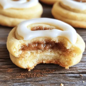 - 2 ¾ cups all-purpose flour - 1 teaspoon baking powder - ½ teaspoon baking soda - ½ teaspoon salt - 1 cup unsalted butter, softened (approximately 2 sticks) - 1 cup granulated sugar - 1 large egg - 1 teaspoon vanilla extract - 1 teaspoon ground cinnamon - ½ cup light brown sugar, packed - 1 cup powdered sugar - 2 tablespoons milk - ½ teaspoon vanilla extract These ingredients create the perfect balance of flavors. The dry ones provide structure, while the wet ingredients add richness. The cinnamon-sugar filling brings warmth, and the icing adds a sweet touch. You will find that this blend makes each bite delightful. For the full recipe, check the details above. Enjoy baking these tasty treats! - Preheat the oven and prepare baking sheets: Start by setting your oven to 350°F (175°C). Line two baking sheets with parchment paper. This helps the cookies not to stick. - Whisk together dry ingredients: In a medium bowl, combine 2 ¾ cups of all-purpose flour, 1 teaspoon of baking powder, ½ teaspoon of baking soda, and ½ teaspoon of salt. Mix them well and set aside. - Cream butter and sugar: In a large bowl, use an electric mixer to beat 1 cup of softened unsalted butter and 1 cup of granulated sugar. Mix for about 3-4 minutes until it looks creamy and light. - Incorporate egg and vanilla: Add in 1 large egg and 1 teaspoon of vanilla extract. Beat the mixture again until everything is well combined. - Blend wet and dry mixtures: Gradually mix the dry ingredient blend into the wet mixture. Stir until just combined. Do not over-mix, as this keeps the cookies soft. - Prepare cinnamon-sugar filling: In a small bowl, mix 1 teaspoon of ground cinnamon with ½ cup of packed light brown sugar. Stir until fully blended. - Form the cookies with filling: Take about 1 tablespoon of dough. Flatten it in your hand, then place 1 teaspoon of the cinnamon-sugar filling in the center. Fold the edges over the filling and roll it into a ball. - Arrange for baking: Place the cookie balls on your prepared baking sheets, leaving about 2 inches between each one. - Bake cookies in preheated oven: Slide the baking sheets into the oven. Bake for 10-12 minutes until the edges turn golden. The cookies may look a bit soft; that’s okay. They will firm up as they cool. - Cooling steps: Let the cookies cool on the baking sheets for about 5 minutes. After that, move them to a wire rack to cool completely. - Whisk ingredients for icing: While the cookies cool, prepare the icing. In a small bowl, whisk together 1 cup of powdered sugar, 2 tablespoons of milk, and ½ teaspoon of vanilla extract until smooth. - Drizzle icing over cookies: Once the cookies are cool, drizzle the icing over each cookie. Let it set for a few minutes before you enjoy them. Feel free to check out the Full Recipe for more details! - Use parchment paper on your baking sheets. This step helps prevent sticking. - Mix the dough just until combined. Over-mixing can make your cookies tough. - For great icing, whisk powdered sugar, milk, and vanilla until smooth. - To drizzle icing, use a spoon or a bag with a small hole. Start in the middle and work out. - Present your cookies on a colorful plate. Add a sprinkle of cinnamon for flair. - Pair these cookies with a warm drink, like coffee or tea. The flavors work well together. For the full recipe, check out the steps to make these delightful treats! {{image_4}} You can elevate your cinnamon roll sugar cookies with fun additions. Add nuts like chopped pecans or walnuts for a crunchy texture. Chocolate chips also work well, giving a sweet twist. You can explore spices too. Try nutmeg or cardamom in the filling for a new flavor. Each option makes your cookies unique and delicious. If you need gluten-free cookies, swap all-purpose flour with a gluten-free blend. This keeps the texture while making it friendly for those with gluten issues. For a vegan treat, use coconut oil instead of butter. Replace the egg with a flaxseed meal or a simple banana. These swaps ensure everyone can enjoy these cookies. Make your cookies festive by adding seasonal flavors. For fall, mix in pumpkin spice or maple flavoring. During the winter holidays, add peppermint extract to the icing. You can also shape the cookies into fun holiday designs. Use cookie cutters for stars or trees. This adds joy to your baking and gives them a special touch. For more ideas, check the Full Recipe for details on how to make these delightful treats! You can store your cookies at room temperature or in the fridge. Cookies at room temp stay soft and taste great for about a week. If you want them to last longer, pop them into the fridge. Always use airtight containers to keep them fresh. This way, they won’t dry out or pick up other smells. You can freeze your cookies before or after baking. If you freeze them before baking, shape your dough balls and place them on a baking sheet. Once they freeze, move them to a bag. For cookies baked, let them cool completely before wrapping. When you are ready to eat, just thaw them on the counter. For the best texture, try to eat them within three months. These cookies can last up to a week at room temperature. You will know they are fresh when they are soft and smell sweet. If they become hard or lose their smell, they have gone stale. Always check for any signs of mold or unusual smells before eating. Fresh cookies are always the best! Cinnamon roll sugar cookies are a delightful blend of soft sugar cookies and cinnamon rolls. They have a rich, buttery flavor with warm notes of cinnamon. The sweet cinnamon-brown sugar filling adds a lovely surprise inside every bite. After baking, I top them with a smooth icing that brings everything together. You get the best of both worlds in one cookie! Yes, you can make these cookies ahead of time! You can prepare the dough and store it in the fridge for up to three days. This keeps the cookies fresh and allows the flavors to mingle. When you’re ready to bake, simply scoop and bake as usual. You can also freeze the dough for up to three months. Thaw it overnight in the fridge before baking. If your dough feels too sticky, don't worry! You can sprinkle a little extra flour onto your work surface. Mix in a bit more flour when shaping the cookies. Just be careful not to add too much, as it can change the texture. A small amount will help you handle the dough easily without losing that soft, tender bite. For softer cookies, try not to over-mix the dough. Mix until just combined to keep them tender. Another tip is to bake them until the edges are lightly golden but the centers still look a bit underbaked. They will firm up as they cool. You can also chill the dough for about 30 minutes before baking; this helps create a softer texture. Absolutely! You can customize the icing to match your taste. Try adding different extracts, like almond or maple, for unique flavors. You can also mix in a little cocoa powder for a chocolate twist. Adding lemon juice can give a tangy touch. Get creative and make the icing your own! You can create delicious cinnamon roll sugar cookies by following our detailed steps. We covered the essential ingredients, preparation, and baking tips. Each part of this process matters to ensure you achieve great results. In conclusion, don't hesitate to try variations or serving suggestions. You can have fun with flavors and find ways to make these cookies your own. Enjoy baking, and remember to share your creations with friends and family!