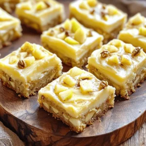 To make these delicious maple frosted apple blondies, gather the following ingredients: - 1 cup unsalted butter, melted - 1 cup packed brown sugar - 2 large eggs - 1 teaspoon vanilla extract - 1 ½ cups all-purpose flour - 1 teaspoon baking powder - ½ teaspoon baking soda - ¼ teaspoon salt - 1 cup diced tart apples (preferably Granny Smith) - ½ teaspoon ground cinnamon - ½ cup chopped walnuts (optional) For the Maple Frosting: - 2 tablespoons unsalted butter, softened - 1 cup powdered sugar - 2 tablespoons pure maple syrup - 1 tablespoon milk (adjust for desired consistency) You can easily swap some ingredients if needed. Here are a few ideas: - Butter: Use coconut oil or applesauce for a dairy-free version. - Brown Sugar: White sugar works if you’re in a pinch. - Eggs: Use flax eggs for a vegan option. Mix 1 tablespoon of ground flaxseed with 2.5 tablespoons of water. - Flour: Whole wheat flour can replace all-purpose flour for a healthier twist. - Nuts: Try pecans or omit them for nut-free blondies. Fresh apples make a big difference in taste. Here’s how to pick the best ones: - Look for firmness: Apples should feel solid and heavy for their size. - Check the skin: Choose apples with smooth, unblemished skin. - Smell: A sweet, fruity aroma often indicates ripeness. - Varieties: Go for Granny Smith for tartness or Honeycrisp for sweetness. Using fresh apples ensures your blondies are packed with flavor. Remember, this recipe brings together simple ingredients for a delightful treat, so make each choice count! For the complete guide on making these blondies, see the Full Recipe. 1. Prepare the Baking Pan and Oven: First, preheat your oven to 350°F (175°C). Grease a 9x9-inch baking pan or line it with parchment paper. This step helps with easy removal later. 2. Cream the Butter and Sugar: In a large bowl, mix the melted butter and brown sugar. Whisk until smooth. This helps create a rich base for your blondies. 3. Incorporate the Eggs: Add the eggs one at a time. Mix well after each egg. Stir in the vanilla extract for extra flavor. 4. Mix Dry Ingredients: In a different bowl, sift together the flour, baking powder, baking soda, salt, and cinnamon. Mix until combined. 5. Combine Wet and Dry Mixtures: Gradually add the dry mix to the butter-sugar mixture. Stir gently until just combined. Be mindful not to overmix. 6. Fold in Apples and Nuts: Carefully fold in the diced apples and nuts if you choose to use them. Spread the mixture evenly in your prepared pan. 7. Bake: Place the pan in your preheated oven. Bake for 25-30 minutes. Check for doneness by inserting a toothpick in the center. It should come out clean. The blondies will have a light golden color. 8. Cool the Blondies: After baking, let the blondies cool in the pan for about 10 minutes. Next, transfer them to a wire rack to cool completely. 9. Prepare the Frosting: In a medium bowl, mix the softened butter, powdered sugar, maple syrup, and milk. Beat until smooth. Add more milk if you want a thinner frosting. 10. Frost the Blondies: Once the blondies are cooled, spread the frosting evenly over the top. Make sure every bite gets a taste of that sweet maple goodness. Now you have a delicious batch of maple frosted apple blondies! For the full recipe, feel free to check the details. Enjoy your baking! To make your blondies moist, follow this simple advice: - Use melted butter for rich flavor. - Measure flour carefully; too much can dry them out. - Avoid overmixing the batter. Mix until just combined. - Add diced apples for extra moisture and flavor. These steps help create that perfect, soft texture. Want to boost the flavor of your blondies? Here are some ideas: - Mix in different spices like nutmeg or allspice. - Use brown sugar for a deeper caramel taste. - Add a splash of lemon juice for brightness. - Consider adding chocolate chips or dried fruit for variety. These simple tweaks take your blondies to the next level. Watch out for these common errors: - Using cold eggs can affect mixing. Always use room temperature eggs. - Forgetting to line your pan can lead to sticking. Grease it or use parchment paper. - Not cooling the blondies before frosting can cause the icing to melt. - Overbaking can make them dry. Start checking at 25 minutes. Avoiding these mistakes ensures tasty blondies every time. {{image_4}} You can easily switch up the nuts in your blondies. Walnuts add a lovely crunch, but pecans work just as well. If you want a bit of sweetness, try adding some toasted almonds. They bring a nice flavor that pairs with the apples and maple frosting. For a nut-free option, skip the nuts altogether. The blondies will still be delicious! If maple frosting isn't your favorite, don't worry! You can try cream cheese frosting for a tangy twist. Simply mix cream cheese with powdered sugar and a splash of vanilla. Another option is a chocolate ganache. Melt chocolate with cream for a rich topping. Each frosting adds a new taste to the blondies. Experiment and find your favorite! To make these blondies gluten-free, swap the all-purpose flour with a gluten-free blend. Make sure the blend has xanthan gum to help with texture. You can also use almond flour for a unique flavor. Just keep in mind that the baking time may change slightly. Check for doneness a few minutes early. Enjoy these sweet treats without gluten worries! For the full recipe, refer back to the provided details. After you bake your maple frosted apple blondies, let them cool completely. Once cool, store them in an airtight container. This keeps them fresh and moist. Place a piece of parchment paper between layers if you stack them. They will last for about 3 to 5 days at room temperature. If you want them to last longer, refrigerate them. In the fridge, they can stay good for up to a week. Freezing blondies is easy and a great way to save some for later. First, let your blondies cool completely. Then, cut them into squares. Wrap each square tightly in plastic wrap. Place the wrapped squares in a freezer-safe bag or container. You can freeze them for up to three months. When you are ready to enjoy them, simply thaw them in the fridge overnight. Sometimes, blondies can become stale. If you find this, don’t worry! You can revive them. Preheat your oven to 350°F (175°C). Place the blondies in a baking dish. Cover them with aluminum foil to keep them from drying out. Heat them for about 10 minutes. This warms them up and softens them. You can also drizzle some maple syrup on top for extra moisture and flavor. Enjoy your revived treat! Yes, you can use different apples. While Granny Smith apples work best, you can try Honeycrisp or Fuji apples. These types add sweetness and texture. Just remember, tart apples keep a nice balance in flavor. To check if the blondies are done, insert a toothpick into the center. If it comes out clean or with a few moist crumbs, they are ready. The edges should look slightly golden, and the center should feel firm but soft. For clean cuts, let the blondies cool completely. Use a sharp knife to cut them into squares. Wipe the knife with a damp cloth between cuts. This method prevents sticking and keeps the edges neat. Enjoy serving your delicious treats! For more details, you can check the Full Recipe. This blog post covered the key steps to make delicious blondies. We talked about choosing the right ingredients, including fresh apples and safe substitutes. You learned how to prepare, bake, and frost them perfectly. I shared tips to keep them moist and avoid common mistakes. Plus, we explored fun variations and storage tips to enjoy blondies later. In the end, you have all the tools to create a tasty treat. Happy baking!