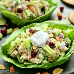 - 2 cups cooked chicken breast, shredded - 1 cup plain Greek yogurt - 1/4 cup diced celery - 1/4 cup diced red onion - 1/4 cup sliced almonds - 1/4 cup dried cranberries - 1 tablespoon Dijon mustard - 1 tablespoon honey (optional) - 1 tablespoon fresh lemon juice - Salt and pepper to taste - 8 large lettuce leaves Greek yogurt chicken salad lettuce wraps are easy to make. You start with cooked chicken breast. I love using shredded chicken for this dish. It makes the salad light and fluffy. The Greek yogurt acts as a creamy base. It gives flavor and a healthy twist. You can add diced celery for crunch. Diced red onion brings a nice bite. Next, I mix in sliced almonds. They add a delightful crunch. Dried cranberries add a touch of sweetness. This balance of flavors is what makes this dish stand out. For the dressing, I use Dijon mustard, fresh lemon juice, and honey. If you want it less sweet, skip the honey. Finally, the salt and pepper bring everything together. The lettuce leaves hold the mixture well. I prefer using romaine or butter lettuce. They are sturdy and easy to wrap. You can serve these wraps with lemon wedges. They add a fresh zing to each bite. - Calories per serving: 250 - Protein: 30g - Carbohydrates: 18g - Fat: 8g This dish is not just tasty; it's also healthy. Each serving gives you a good amount of protein from the chicken. The Greek yogurt adds more protein while keeping it low in fat. The fresh veggies give you vitamins and minerals. Using Greek yogurt offers many advantages. It is rich in protein and low in fat. It helps keep you full without excess calories. Chicken is a great protein source too. It supports muscle growth and repair. Fresh vegetables like celery and onions add fiber. Fiber helps with digestion and keeps you healthy. - Combine chicken, celery, and red onion in a bowl. - Prepare the creamy yogurt dressing. Start by placing the shredded chicken in a large bowl. Add the diced celery and red onion. Use a fork or spoon to mix them well. Make sure everything is spread out evenly. Next, in a separate bowl, combine the yogurt, Dijon mustard, honey, lemon juice, salt, and pepper. Whisk until the mixture is smooth. This creamy dressing adds flavor and moisture to the chicken salad. - Pour yogurt mixture over the chicken. - Fold in almonds and cranberries. Now, pour the yogurt dressing over the chicken mix. Stir gently until everything is coated. You want each piece of chicken to have that creamy dressing. Then, fold in the sliced almonds and dried cranberries. These add a nice crunch and a hint of sweetness. Mix just enough to keep the almonds whole. - Instructions for wrapping in lettuce leaves. - Tips for securing the wraps. To make the wraps, take a large lettuce leaf. Place a good spoonful of the chicken salad in the center. Fold the sides of the leaf over the filling. This creates a neat wrap. If you want, use a toothpick to hold the wrap together. This makes it easier to eat. Continue wrapping until all the chicken salad is used up. Enjoy these fresh and tasty wraps! To make your Greek yogurt chicken salad tasty, use fresh herbs like dill or parsley. They add a bright flavor. You can also sprinkle in garlic powder or onion powder for a nice kick. If you want sweetness but don’t have honey, try maple syrup or agave nectar. Both work well and add their unique touch. When serving the wraps, arrange them on a large platter. Drizzle a bit of honey over the wraps for a nice shine. You can add lemon wedges on the side. They give a fresh burst of flavor. Pair these wraps with a light salad or some veggie sticks for a complete meal. To store your chicken salad, keep it in an airtight container in the fridge. It stays fresh for up to three days. For the best taste, serve the salad in the wraps just before eating. This keeps the lettuce crisp and the filling flavorful. If you mix it too early, the lettuce can get soggy. {{image_4}} You can switch out the chicken for other proteins. Tofu works great for a plant-based option. Chickpeas are also a tasty choice and add fiber. For veggies, try diced bell peppers or shredded carrots. These add color and crunch to the mix. Spices can change the game. Try adding paprika or garlic powder for extra depth. Fresh herbs like dill or parsley can brighten the flavor. For dressings, use ranch or a spicy sriracha mix. These options give your wraps a unique twist. For gluten-free wraps, use lettuce as your base. This dish naturally fits low-carb diets too. If you want a vegan version, swap Greek yogurt for a dairy-free alternative. Cashew cream or coconut yogurt can work well here. These changes keep your meal healthy and satisfying. To keep your Greek yogurt chicken salad fresh, store it in an airtight container. Make sure to seal it tightly. This helps prevent odors from your fridge from seeping in. For the lettuce wraps, I suggest wrapping them in damp paper towels before placing them in a container. This keeps them crisp and fresh. Avoid stacking the wraps on top of each other to prevent crushing. You can freeze the chicken salad, but it may change texture. If you want to freeze it, store the salad in a freezer-safe container. Leave some space at the top for expansion. To thaw, place the container in the fridge overnight. When ready to serve, mix it well. If it seems too thick, add a bit of Greek yogurt to restore creaminess. Leftovers can last in the fridge for about three to four days. Always check for signs of spoilage, like a sour smell or discoloration. If anything seems off, it’s best to toss it. Enjoy your Greek yogurt chicken salad while it’s fresh for the best taste! To make these wraps, start with shredded chicken. Place it in a large bowl. Add diced celery and red onion. Mix these gently with a fork. In another bowl, whisk Greek yogurt, Dijon mustard, honey, lemon juice, salt, and pepper. Pour this creamy mix over the chicken. Stir gently until everything is coated. Fold in sliced almonds and dried cranberries for crunch. Take a lettuce leaf and add a spoonful of the chicken salad. Wrap the sides over the filling. If needed, use a toothpick to hold it together. Repeat until all wraps are made. Yes, rotisserie chicken is a great choice for this recipe. It saves time and effort. The chicken is already cooked and flavorful. Just shred it and mix it into the salad. This makes your prep time shorter. You can have a tasty meal ready in minutes. If you don’t want to use lettuce, there are many options. You can use whole grain tortillas or pita bread. They add a different texture and flavor. You can also try using collard greens or cabbage leaves. They are sturdy and work well as wraps. Another option is to serve the chicken salad in bowls. Just add some fresh veggies on the side. This post shared a simple recipe for Greek Yogurt Chicken Salad Lettuce Wraps. You learned about the main ingredients, their health benefits, and step-by-step instructions. I also covered tips for flavor enhancements and variations for dietary needs. Wraps are versatile and easy to customize. Use this recipe as a guide to create a dish you'll love. Healthy eating can be simple and fun. Enjoy your cooking journey with these wraps!