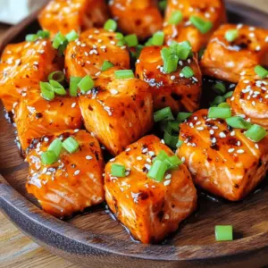- 1 lb salmon fillet, skin removed and cut into bite-sized cubes - 2 tablespoons honey - 2 tablespoons sriracha sauce - 1 tablespoon soy sauce - 1 teaspoon garlic powder - 1 teaspoon fresh ginger, grated - 1 tablespoon olive oil - Salt and pepper to taste - Chopped green onions for garnish - Sesame seeds for garnish You can add a splash of lime juice for a zesty kick. Fresh cilantro adds a nice herb flavor too. For those who like it spicy, include extra sriracha or a pinch of cayenne pepper. If you don’t have honey, maple syrup works well. For a gluten-free option, use tamari instead of soy sauce. No fresh ginger? Ground ginger can be a good substitute, just use less. To start, grab a medium bowl. In it, whisk together these key ingredients: - 2 tablespoons honey - 2 tablespoons sriracha sauce - 1 tablespoon soy sauce - 1 teaspoon garlic powder - 1 teaspoon fresh ginger, grated Mix until everything is smooth. The honey gives sweetness, while the sriracha adds heat. The soy sauce brings depth, and the garlic and ginger add flavor. This marinade makes your salmon bites pop! Now, take your 1 lb salmon fillet. Cut it into bite-sized cubes. Add the salmon cubes to the marinade. Gently toss them to coat each piece well. Let the salmon marinate at room temperature for 15 minutes. This wait allows the flavors to soak in deeply. While the salmon marinates, preheat your air fryer to 400°F (200°C). This usually takes about 5 minutes. After that, drizzle 1 tablespoon of olive oil over the marinated salmon. Lightly season it with salt and pepper. Place the salmon bites in the air fryer basket. Make sure they are in a single layer. Leave some space between each piece for even cooking. You may need to work in batches if your air fryer is small. Air fry the salmon bites for 8-10 minutes. Shake the basket halfway through to help them cook evenly. The salmon should be tender and crispy. Once they are done, carefully remove them using tongs and let them rest for a minute. Finally, transfer your salmon bites to a serving plate. Garnish them with chopped green onions and sesame seeds for a nice touch. Enjoy your tasty and quick air fryer honey sriracha salmon bites! To cook your salmon bites evenly, place them in a single layer in the air fryer. This allows hot air to circulate around each piece. If your air fryer is small, cook in batches. Shaking the basket halfway through helps too. This keeps the salmon from sticking and ensures even cooking. To get that crispy exterior, coat the salmon bites lightly with olive oil. The oil helps create a nice crust during cooking. Make sure to avoid overcrowding in the basket. The more space each piece has, the crispier they will get. Cook for 8-10 minutes, checking for that beautiful golden color. These salmon bites are great on their own, but you can add fun sides. Try serving them with rice or a fresh salad. You can also drizzle more honey sriracha sauce on top for extra flavor. Garnish with chopped green onions and sesame seeds for added crunch and color. Enjoy your meal with friends or family for a fun dinner night! {{image_4}} You can change the flavor of your salmon bites by using different marinades. Here are a few ideas: - Teriyaki Marinade: Swap honey and sriracha for teriyaki sauce. This gives a sweet and savory taste. - Lemon Garlic Marinade: Mix lemon juice, garlic, and olive oil. This adds a fresh zing. - Herb Marinade: Use fresh herbs like dill and parsley with olive oil. This brings a vibrant flavor. Each marinade offers a unique twist. Feel free to mix and match flavors based on your taste. If you don’t have an air fryer, you can still enjoy these salmon bites. Here are other cooking methods: - Oven Baking: Preheat your oven to 400°F (200°C). Place the salmon bites on a baking sheet lined with parchment paper. Bake for 12-15 minutes until cooked through. - Grilling: Preheat your grill to medium heat. Thread the salmon onto skewers and grill for 8-10 minutes, flipping halfway. - Pan-Searing: Heat a skillet over medium-high heat. Cook the salmon bites for 3-4 minutes on each side until crispy. These methods will give you delicious results too! Pairing these salmon bites with the right sides can elevate your meal. Here are some great options: - Steamed Broccoli: This adds a healthy crunch and bright color. - Rice: Serve with jasmine or brown rice to soak up the flavors. - Salad: A fresh green salad with a light vinaigrette complements the rich salmon taste. Mix and match these sides to create a balanced and tasty meal that everyone will love. After enjoying your Air Fryer Honey Sriracha Salmon Bites, you might have some left. Store them in an airtight container. Place them in the fridge. They stay fresh for up to three days. Make sure to let the salmon cool before sealing. This keeps the flavors intact. When you're ready to eat leftovers, reheating is easy. Use your air fryer for the best results. Preheat it to 350°F (175°C). Place the salmon bites in the basket. Heat them for about 5 minutes. This warms them up and keeps them crispy. You can also use a microwave if you’re in a hurry. Just heat them for 30 seconds at a time until warm. If you want to save some for later, freezing is a great option. Let the salmon bites cool completely. Arrange them in a single layer on a baking sheet. Freeze them for about an hour. Once frozen, transfer them to a freezer-safe bag. Remove as much air as possible. They can last up to three months in the freezer. When ready to cook, thaw them in the fridge overnight and reheat. You should marinate the salmon for at least 15 minutes. This time allows the flavors to soak into the fish. If you have time, marinating for 30 minutes or even an hour can enhance the taste. Just cover the bowl and keep it in a cool place while it marinates. Yes, you can use frozen salmon. Just make sure to thaw it first. You can do this by placing it in the fridge overnight or using a microwave in defrost mode. After thawing, remove the skin and cut it into bite-sized cubes before marinating. This way, the marinade will coat the salmon well. These salmon bites pair well with many sides. Here are a few ideas: - Steamed rice or quinoa for a filling base. - A fresh salad with mixed greens and a light dressing. - Roasted vegetables like broccoli or carrots for added color and nutrition. - Noodles tossed in a light soy or sesame sauce for a fun twist. Choose the sides that you love most! You now have a clear guide on making delicious honey sriracha salmon bites. We covered key ingredients, marinating steps, and cooking tips for perfect results. Remember to try different marinades for new flavors and use the right methods for cooking and serving. Storing leftovers properly also helps you enjoy these bites later. Overall, I hope you feel inspired to create your own tasty salmon dish. Happy cooking!