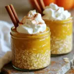 To make Pumpkin Spice Latte Overnight Oats, gather these key ingredients: - 1 cup rolled oats - 1 cup almond milk (or any milk of your choice) - 1/2 cup canned pumpkin puree - 1 tablespoon maple syrup (or honey) - 1 teaspoon pumpkin pie spice - 1/2 teaspoon vanilla extract - A pinch of salt These ingredients create a creamy and flavorful base for your oats. The rolled oats provide a hearty texture. Almond milk gives it a nice creaminess. Canned pumpkin adds both flavor and nutrition. Maple syrup or honey brings sweetness. Pumpkin pie spice gives that warm, cozy taste. Vanilla extract enhances the overall flavor. A pinch of salt balances the sweetness. You can add these optional ingredients for extra flavor and texture: - 2 tablespoons chia seeds (for extra thickness) Chia seeds are a great option. They soak up liquid and thicken your oats. They also add healthy nutrients, making your breakfast even better. Feel free to mix and match based on what you like! When serving your oats, consider these fun toppings: - Whipped cream - Cinnamon stick Whipped cream adds a lovely touch and makes it feel special. A sprinkle of cinnamon or more pumpkin pie spice can enhance the flavor. The cinnamon stick not only looks good but adds extra warmth. You can also serve it with a rustic cloth and a small spoon to create a cozy vibe. Enjoy customizing your breakfast! To start, gather your ingredients. You will need rolled oats, almond milk, canned pumpkin puree, maple syrup, pumpkin pie spice, vanilla extract, and a pinch of salt. If you want extra thickness, add chia seeds. In a large bowl, mix all the ingredients together. Make sure everything blends well. The color should be a nice orange from the pumpkin. Next, divide the mixture into two airtight jars. This helps keep the oats fresh. Seal the jars tightly. Place them in the fridge for at least four hours. If you can, let them sit overnight. This helps the oats soak up all the flavors. When you are ready to enjoy, take the jars out and stir them well. For serving, you can eat the oats cold or warm them in the microwave. Top each jar with whipped cream for a sweet finish. A sprinkle of cinnamon or more pumpkin spice adds a nice touch. You can also add a cinnamon stick for a pretty look. Enjoy your delicious pumpkin spice latte overnight oats! To get the right texture, use rolled oats. They soak up liquid well. Combine oats with milk and pumpkin puree. Stir until smooth. If you want thicker oats, add chia seeds. They make your oats creamier. Let the mixture chill for at least four hours. Overnight is best for the perfect softness. To boost flavor, try adding a pinch of nutmeg. It pairs well with pumpkin spice. You can also mix in some chocolate chips for sweetness. For a richer taste, use flavored almond milk. A splash of coffee can add a nice kick too. Don't hesitate to experiment; your taste is what matters. Make your oats in the evening for a quick breakfast. Set up your jars the night before. Pre-measure your ingredients to save time. You can even make a big batch for the week. Store jars in the fridge for up to five days. This way, you’ll always have a tasty meal ready. {{image_4}} You can easily make pumpkin spice latte overnight oats dairy-free. Just swap the almond milk for your favorite plant-based milk. Options like coconut milk or oat milk work great too. Both add their unique taste and creaminess. If you prefer a nut-free option, go for soy milk or rice milk. These choices keep the flavor but remove dairy. Feel free to play with flavors! You can add a splash of espresso or coffee for an extra kick. If you want more sweetness, try adding a touch of brown sugar or a dash of nutmeg. For a touch of crunch, mix in some granola or pumpkin seeds. These little changes can make your oats exciting and new each time. If you need a nut-free version, just use oat milk or soy milk instead of almond milk. Check your oats to ensure they are nut-free as well. For toppings, skip the nuts and choose seeds, like sunflower or pumpkin seeds. This way, you can enjoy your oats without worrying about nuts. To keep your Pumpkin Spice Latte Overnight Oats fresh, use airtight containers. Glass jars work best. Make sure the lids are sealed tightly. Store them in the fridge right after you prepare them. This helps keep the oats from drying out and losing flavor. Your overnight oats can last up to five days in the fridge. The flavors deepen as they sit, making each bite even better. Keep an eye on the oats for any signs of spoilage. If they smell off or look different, it's best to toss them out. Always check your ingredients' dates, too, especially the almond milk. If you prefer warm oats, you can reheat them easily. Just take the jar out of the fridge. Remove the lid and microwave for about 30 seconds. Stir well and check the temperature. If it’s not warm enough, heat for another 15 seconds. Enjoy your oats hot, or you can eat them cold if you like! Yes, you can make these oats ahead of time. I often prepare them the night before. This lets the flavors blend well. You can store them in the fridge for up to five days. Just keep them in airtight jars. This makes breakfast super easy on busy mornings! If you don’t have almond milk, don’t worry! You can use any milk you like. Cow's milk, oat milk, or soy milk work great. Each option brings its own flavor. Choose the one that fits your taste best. Yes, overnight oats are healthy! They are full of fiber, protein, and nutrients. The oats keep you full and give you energy. Adding pumpkin puree adds vitamins and minerals. Chia seeds boost nutrition too. You can make them as healthy as you want with your favorite toppings. We explored how to make delicious Pumpkin Spice Latte Overnight Oats. You learned about the key ingredients and optional add-ins to customize your oats. I shared step-by-step instructions to get the perfect texture. Tips helped you enhance flavors and save time. You also discovered variations for dietary needs and proper storage methods. Try these tasty oats for a quick, healthy breakfast. They blend flavor and nutrients perfectly. Enjoy these oats any time of day!