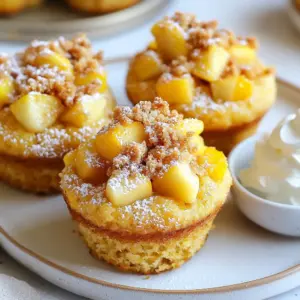 To make these muffins, gather the following main ingredients: - 1 cup pumpkin puree - 1 cup apples, peeled and diced - 2 cups all-purpose flour - 1 teaspoon baking powder - 1 teaspoon baking soda - ½ teaspoon salt - 2 teaspoons ground cinnamon - ½ teaspoon ground nutmeg - 1 cup granulated sugar - ½ cup packed brown sugar - 2 large eggs - ½ cup vegetable oil - ½ cup milk - 1 teaspoon vanilla extract These ingredients create a tasty blend of flavors. The pumpkin gives moisture, while the apples add sweetness and texture. For a crunchy topping, use these ingredients: - ½ cup rolled oats - ½ cup all-purpose flour - ¼ cup packed brown sugar - ½ teaspoon ground cinnamon - ¼ cup cold butter, cubed This streusel adds a nice texture. The oats provide a hearty crunch, and the cinnamon gives a warm spice. You can make a few swaps if you need to. Here are some tips: - Gluten-free flour can replace all-purpose flour for a gluten-free option. - Applesauce can substitute for some oil to cut fat. - If you lack pumpkin puree, use mashed banana or sweet potato. - For a dairy-free version, use almond or oat milk instead of regular milk. These swaps can help if you have allergies or dietary needs while keeping the muffins delicious. {{ingredient_image_2}} First, you need to preheat your oven to 375°F (190°C). This helps the muffins bake evenly. While the oven heats, prepare your muffin tin. You can use paper liners for easy cleanup. If you prefer, lightly grease the tin with butter to help the muffins slide out easily. For the streusel topping, grab a medium bowl. Combine ½ cup of rolled oats, ½ cup of all-purpose flour, and ¼ cup of packed brown sugar. Add ½ teaspoon of ground cinnamon for flavor. Next, cut in ¼ cup of cold butter until it looks like coarse crumbs. Set this mixture aside so the flavors blend. Now, take a large bowl to mix the dry ingredients. Whisk together 2 cups of all-purpose flour, 1 teaspoon of baking powder, 1 teaspoon of baking soda, and ½ teaspoon of salt. Add 2 teaspoons of ground cinnamon and ½ teaspoon of ground nutmeg. This step helps distribute the leavening agents and spices evenly. In a separate medium bowl, mix the wet ingredients. Combine 1 cup of granulated sugar, ½ cup of packed brown sugar, and 2 large eggs. Then add ½ cup of vegetable oil, ½ cup of milk, 1 cup of pumpkin puree, and 1 teaspoon of vanilla extract. Whisk until smooth. Gently pour the wet mixture into the dry ingredients. Use a spatula to fold them together until just combined. Avoid overmixing to keep your muffins light. Finally, fold in 1 cup of diced apples, making sure they are evenly mixed throughout the batter. Now, it's time to fill the muffin tin. Use a spoon or an ice cream scoop to fill each cup about ¾ full. This allows space for the muffins to rise while baking. Sprinkle the streusel topping generously over each filled muffin cup. This gives a lovely crunch on top. Place the muffin tin in the preheated oven. Bake for 18-20 minutes. To check for doneness, insert a toothpick into the center of a muffin. It should come out clean or with a few crumbs. After baking, remove the tin from the oven. Let the muffins cool in the pan for about 5 minutes. This helps them set. Then transfer the muffins to a wire rack to cool completely. Enjoy the warm, inviting smell filling your kitchen! To keep your muffins moist, use fresh pumpkin puree. Canned pumpkin works well too. Make sure not to overmix the batter. Overmixing can create tough muffins. Add diced apples just before baking. This adds moisture and flavor. Start with dry and wet ingredients in separate bowls. Whisk dry ingredients well to mix evenly. When you combine them, fold gently. Stop mixing as soon as you see no dry flour. Lumps are okay, and they help keep muffins light. Set a timer for 18 minutes. Check for doneness with a toothpick. It should come out clean or with just a few crumbs. If it comes out wet, bake for another minute. Keep an eye on them to avoid dry muffins. Pro Tips Use Fresh Apples: For the best flavor, choose crisp, fresh apples like Granny Smith or Honeycrisp. Their tartness will complement the sweetness of the muffins beautifully. Don't Overmix: When combining wet and dry ingredients, mix just until combined. Overmixing can lead to dense muffins instead of light and fluffy ones. Cool Before Storing: Let the muffins cool completely on a wire rack before storing them. This prevents moisture from building up and keeps them fresher longer. Experiment with Spices: Feel free to adjust the spices in the recipe. Adding a pinch of ginger or cloves can add a unique twist to the flavor profile. {{image_4}} You can add nuts or seeds to the batter for a crunchy bite. Chopped walnuts or pecans work great. You can also use sunflower seeds or pumpkin seeds. Add about ½ cup of your choice to the mixture before folding in the apples. This small change gives your muffins a nice crunch and boosts nutrition. If you want to try different flavors, swap the apples with other fruits. Pears or bananas can work well. Diced peaches or berries can add a fresh twist too. Just keep the amount the same, about 1 cup. Each fruit brings a unique taste to the muffins. To make these muffins gluten-free, use a good gluten-free flour blend. You can find many options at stores or online. Replace the all-purpose flour with this blend in equal amounts. Be sure to add a little xanthan gum if it’s not in the flour blend. This helps the muffins rise and stay together. To keep your Apple Pumpkin Streusel Muffins fresh, store them at room temperature. Place them in an airtight container. This helps maintain their soft texture. If you plan to eat them within a few days, this method works well. Keep them away from direct sunlight or heat sources. You can freeze these muffins if you want to save some for later. First, let them cool completely. Next, wrap each muffin in plastic wrap. Then, place them in a freezer-safe bag. Be sure to remove as much air as possible. You can freeze them for up to three months. When you’re ready to eat, just take them out and thaw them at room temperature. To enjoy your muffins warm, you can reheat them in the oven or microwave. For the oven, preheat it to 350°F (175°C). Place the muffins on a baking sheet for about 10 minutes. If you use the microwave, heat them for about 15-20 seconds. Check to avoid overheating. Warm muffins taste best when they are soft and fluffy. Yes, you can make these muffins ahead of time. Prepare the batter and fill the muffin tin. Cover it and place it in the fridge overnight. Bake them fresh in the morning for best taste. Check the muffins at 18 minutes. Insert a toothpick in the center of one muffin. If it comes out clean or with a few crumbs, they are done. If not, bake for another minute and check again. Serve them warm for the best flavor. You can dust them with powdered sugar. Pair them with whipped cream or fresh apple slices to add a nice touch. Yes, homemade pumpkin puree works great. Just make sure it’s thick and not too watery. This will keep your muffins from becoming soggy. Each muffin has about 200 calories. This can vary based on the specific brands and amounts of ingredients used. Enjoy them as a treat in moderation! Apple Pumpkin Streusel Muffins are fun and easy to make. We covered key ingredients, steps, and helpful tips. Using the right methods ensures your muffins turn out moist and tasty. Don’t forget to try different fruits or go gluten-free for variety. Store them right and enjoy them fresh or frozen later. Making these muffins is rewarding and simple. I hope you dive in and enjoy every bite!