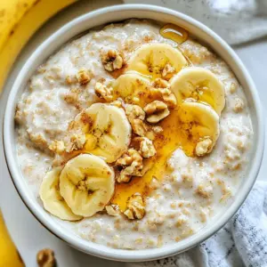 For perfect brown sugar overnight oats, gather these key ingredients: - 1 cup rolled oats - 2 cups unsweetened almond milk (or any milk of your choice) - 2 tablespoons light brown sugar - 1 teaspoon ground cinnamon - 1 teaspoon pure vanilla extract - A pinch of sea salt These ingredients combine to create a creamy and flavorful base. The rolled oats soak up the milk overnight, becoming soft and delicious. Almond milk adds a subtle nutty taste. Brown sugar gives the oats a warm sweetness, while cinnamon and vanilla enhance the flavor. You can make your oats even more delightful by adding toppings. Here are some great choices: - Sliced bananas - Chopped walnuts or pecans - A drizzle of honey - A handful of fresh berries These toppings let you customize your oats. Bananas add sweetness. Nuts give a nice crunch. Honey offers extra richness. Berries bring a burst of color and fresh flavor. If you don’t have all the ingredients, no problem! Here are some easy swaps: - Use regular milk instead of almond milk. - Replace light brown sugar with coconut sugar or maple syrup. - Swap out ground cinnamon for pumpkin pie spice for a different flavor. These substitutions keep your oats tasty while catering to your pantry. Don’t hesitate to mix and match based on what you have at home. {{ingredient_image_2}} Start by gathering your ingredients. You need rolled oats, almond milk, light brown sugar, ground cinnamon, vanilla extract, and a pinch of sea salt. In a medium bowl, combine 1 cup of rolled oats with 2 cups of unsweetened almond milk. Next, add 2 tablespoons of light brown sugar, 1 teaspoon of ground cinnamon, and 1 teaspoon of vanilla extract. Don't forget that pinch of sea salt! Whisk these together until the brown sugar dissolves and all flavors mix well. This step ensures your oats are sweet and full of flavor. Once your oat mixture is ready, it’s time to store it. Pour it into individual jars or airtight containers. Make sure each jar is sealed tight. Place them in the refrigerator. Let the oats chill and soak overnight. If you are short on time, four hours will do. Soaking allows the oats to absorb the liquid, making them soft and creamy. When you are ready to eat, take a jar from the fridge. Give the oats a good stir to mix everything. If they are too thick, add a splash of almond milk for creaminess. Now, it's time to add your favorite toppings! Try sliced bananas for sweetness, chopped walnuts or pecans for crunch, a drizzle of honey for richness, or fresh berries for a burst of color. Serve in clear jars to show off those lovely layers! To make your brown sugar overnight oats creamy, follow these steps. Use rolled oats, as they soak well. Combine them with your chosen milk in a bowl. Whisk until the brown sugar mixes in fully. If the oats feel thick after chilling, add more milk. A splash will help achieve a smooth texture. Remember, the longer they soak, the creamier they become. Store your overnight oats in jars or airtight containers. This keeps them fresh and prevents spills. Label each jar with the date you made them. This way, you know when to eat them. Place them in the fridge right after you mix. They will stay good for up to five days. Just stir them before eating for the best taste. Elevate your overnight oats with simple additions. Sliced bananas bring natural sweetness. Chopped nuts add a nice crunch. A drizzle of honey offers extra richness. Fresh berries pop with color and flavor. You can also try a sprinkle of cocoa powder for a chocolatey twist. Mix and match to find your favorite combinations. Pro Tips Use Steel-Cut Oats for Texture: If you prefer a chewier texture, substitute rolled oats with steel-cut oats. Just remember to increase the soaking time to overnight or even longer. Mix in Chia Seeds: Incorporating chia seeds not only boosts the nutritional value but also helps thicken the oats for a creamier consistency. Experiment with Spices: Don’t limit yourself to cinnamon; try adding nutmeg, ginger, or even cardamom for unique flavor variations. Prep Ahead for Busy Mornings: Make several jars at once and store them in the fridge for quick grab-and-go breakfasts throughout the week. {{image_4}} You can make these oats nut-free. Just swap the almond milk for oat milk or soy milk. These options taste great and keep the dish creamy. If you want crunch, add seeds like pumpkin or sunflower seeds instead of nuts. This way, you still get texture without the nuts. To make your oats vegan, stick to plant-based milk. Almond milk works well, but you can also try coconut or hemp milk. Use maple syrup instead of brown sugar for sweetness. This keeps the dish completely vegan while still being delicious. You won’t miss the dairy at all! The fun doesn’t stop with just brown sugar. You can add chocolate or fruit for extra flavor. For chocolate lovers, stir in cocoa powder or chocolate chips. For a fruity twist, add sliced bananas or fresh berries. You can also mix in spices like nutmeg or ginger for a warm taste. The options are endless! Brown sugar overnight oats can last up to five days in the fridge. Make sure to store them in airtight containers. This keeps the oats fresh and tasty. If you notice any odd smell or change in color, it’s best to toss them out. I recommend using glass jars or BPA-free plastic containers. Glass jars are great for seeing the layers of oats and toppings. They also keep the oats from absorbing any unwanted odors. Choose containers with tight-fitting lids to seal in freshness. If you want to warm your oats, take them out of the fridge. You can heat them in the microwave for 30 seconds to a minute. Stir halfway through to ensure even heating. If they seem dry, add a splash of almond milk. This helps restore creaminess and flavor. Enjoy your oats warm or cold, based on your preference! Yes, you can use quick oats. They cook faster and absorb liquid quickly. However, they might not give the same chewy texture as rolled oats. If you want a softer mix, quick oats can work well. Just remember that soaking time may need to be shorter. To make your oats sweeter, add more brown sugar or honey. You can also use maple syrup or agave nectar for a different flavor. Adding fruits like bananas or berries can boost sweetness too. Experiment with the amount until you find your perfect taste. Soaking oats overnight is best for texture and flavor. It allows the oats to absorb the milk and soften. If you are short on time, you can soak them for at least 4 hours. But overnight soaking gives the best results for a creamy dish. Brown sugar overnight oats are easy to make and delicious. You learned about key ingredients, step-by-step methods, and tips to enhance your oats. With options for toppings and flavor variations, you can customize this dish to your taste. Remember to use the right storage for freshness and enjoy your oats any time. Experiment with ingredients and make it your own. With a few simple steps, you can create a healthy breakfast that you love. Enjoy your oats and make each bowl great!