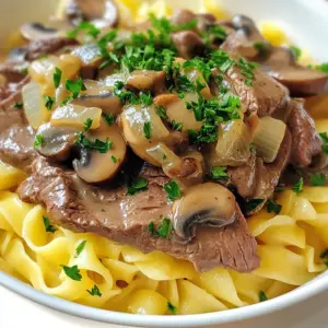 - 500g beef sirloin, thinly sliced - 1 tablespoon olive oil - 1 medium onion, finely chopped - 2 cloves garlic, minced - 250g mushrooms, sliced (button or cremini recommended) - 1 tablespoon Dijon mustard - 300ml beef broth - 150ml sour cream - 1 tablespoon Worcestershire sauce - Salt and pepper to taste - Fresh parsley, chopped (for garnish) - 300g egg noodles or rice (for serving) These ingredients create a rich and flavorful beef stroganoff. The beef sirloin offers tenderness, while the onions and garlic add depth. You can add a splash of white wine for acidity. A sprinkle of smoked paprika can add warmth. For a spicier kick, toss in some red pepper flakes. If you like herbs, try thyme or dill for fresh notes. These options help you customize the dish to your taste. - Large pot for boiling noodles or rice - Large skillet for cooking - Cutting board and knife for chopping - Measuring spoons and cups for accuracy - Wooden spoon for stirring These tools make cooking easier and help you create a delicious meal. Having everything ready will keep your cooking smooth and fun. {{ingredient_image_2}} Start by boiling water in a large pot. Add a generous pinch of salt to the water. Then, add 300 grams of egg noodles or rice. Cook them according to the package directions until they are al dente. Once done, drain and keep warm while you make the beef stroganoff. Heat one tablespoon of olive oil in a large pan over medium to high heat. Add 500 grams of thinly sliced beef sirloin. Season it with salt and pepper. Sear the beef for 2 to 3 minutes until it turns brown. Make sure it's not fully cooked yet. Take the beef out of the pan and set it aside. In the same pan, add one finely chopped medium onion. Sauté for about 2 to 3 minutes until the onion softens. Then, add two minced garlic cloves. Cook for another minute until it smells amazing. This adds a nice base flavor to your dish. Now, it’s time for the mushrooms. Add 250 grams of sliced mushrooms to the pan. Stir them often for about 5 minutes until they are golden brown and tender. This step brings out their rich flavor. Next, add one tablespoon of Dijon mustard and one tablespoon of Worcestershire sauce to the pan. Pour in 300 milliliters of beef broth. Bring this mixture to a gentle boil. Let it simmer for about 5 minutes so the flavors can blend nicely. Lower the heat and stir in 150 milliliters of sour cream. Mix it well until it’s smooth. Add the beef back into the pan and let it simmer for 3 to 4 minutes. This helps the beef to cook through and absorb the creamy sauce. Taste and add salt and pepper if needed. To serve, place the warm egg noodles or rice on plates. Spoon the rich beef stroganoff mixture on top. Finally, sprinkle some fresh chopped parsley over the dish for a pop of color and freshness. Enjoy your Gordon Ramsay-style beef stroganoff! To make great beef stroganoff, start with good beef. Use 500g of beef sirloin. Slice it thinly against the grain. This helps the beef stay tender. When cooking, heat your pan well first. Add 1 tablespoon of olive oil. Sear the beef for just 2-3 minutes. You want it browned but still rare inside. Remove the beef before it cooks too much. It will finish cooking later in the sauce. For mushrooms, I like using button or cremini mushrooms. Slice 250g of mushrooms evenly. This helps them cook at the same rate. In the same pan, add the mushrooms after the beef. Cook them for about 5 minutes. Stir them often until they are golden and tender. This brings out their rich flavor. Don't rush this step. Properly cooked mushrooms add depth to your dish. Seasoning is key for flavor. Always use salt and fresh ground pepper. Add these to taste during cooking. I also like to use 1 tablespoon of Dijon mustard and 1 tablespoon of Worcestershire sauce. These ingredients add a nice tang. Lastly, mix in 300ml of beef broth. Let this simmer to bring all the flavors together. Finish with 150ml of sour cream for a creamy texture. This combination will elevate your stroganoff, making it rich and flavorful. Pro Tips Use High-Quality Beef: Choosing a good cut of beef, like sirloin or tenderloin, will ensure your stroganoff is tender and flavorful. Don’t Overcook the Meat: Searing the beef quickly keeps it tender. Remove it from the pan while it’s still slightly undercooked, as it will continue to cook in the sauce. Fresh Ingredients Matter: Using fresh mushrooms and herbs, like parsley, enhances the dish's flavor and presentation. Adjust the Creaminess: For a richer sauce, you can add more sour cream or a splash of heavy cream to taste, making the dish even creamier. {{image_4}} You can swap beef with other meats. Chicken or pork works well. Cut them thin like beef. Cook them the same way. This makes a tasty dish too. Want a meat-free option? Use mushrooms as your main protein. Portobello or shiitake mushrooms add depth. Sauté them like beef. Add tofu for extra protein. Use vegetable broth instead of beef broth. This makes a rich and creamy sauce. You can play with the sauce. Try adding red wine for a deeper flavor. Or, use coconut milk for a creamy twist. You can also add herbs like thyme or rosemary. They add freshness to the dish. Use different mustards for unique tastes. Each variation brings a new twist to your stroganoff. To store leftovers, first let the beef stroganoff cool. Then, place it in an airtight container. Make sure to keep it in the fridge. It will stay fresh for up to three days. When ready to eat, check for any signs of spoilage before reheating. Reheat your beef stroganoff on the stove for the best taste. Use a medium heat setting. Stir often to prevent sticking. If the sauce seems thick, add a splash of beef broth or water. You can also microwave it. Place it in a microwave-safe bowl and cover it loosely. Heat for 1-2 minutes, stirring halfway. You can freeze beef stroganoff for up to three months. Use a freezer-safe container or a heavy-duty freezer bag. Make sure to leave some space at the top for expansion. To thaw, place it in the fridge overnight. Reheat it as mentioned above when you’re ready to enjoy it again. Beef Stroganoff is a creamy, rich dish made with tender beef and mushrooms. It often has a flavorful sauce made from beef broth and sour cream. You serve it over noodles or rice, making it hearty and filling. This dish is a classic from Russia, loved for its comfort and flavor. Yes, you can use different meats for Beef Stroganoff. Chicken, pork, or even turkey work well. Just cut the meat into thin slices. Cook it the same way as beef. Each meat gives a unique taste, so feel free to experiment. To make Beef Stroganoff gluten-free, choose gluten-free noodles or rice for the base. For the sauce, ensure the beef broth and Worcestershire sauce are gluten-free. Many brands offer gluten-free options. This way, you enjoy the dish without gluten. Beef Stroganoff pairs nicely with several sides. Here are some great options: - Egg noodles - Rice - Mashed potatoes - Steamed broccoli - Green beans These sides balance the rich flavors of the Stroganoff and add freshness to your meal. In this post, I covered how to make Gordon Ramsay's beef stroganoff. I shared the main and optional ingredients, the tools you need, and step-by-step cooking instructions. I also included tips for perfect beef, mushroom cooking, and flavoring. You learned various dish variations and storage tips. Beef stroganoff is a versatile, comforting meal. With the right techniques and ingredients, you can make it your own. Enjoy cooking and impressing your family and friends with this classic dish.
