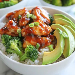 To make Honey BBQ Chicken Rice Bowls, gather these simple ingredients: - 2 cups cooked jasmine rice - 1 lb boneless, skinless chicken thighs, diced into bite-sized pieces - 1/2 cup honey - 1/2 cup your favorite BBQ sauce - 1 tablespoon soy sauce - 1 tablespoon olive oil - 1 teaspoon garlic powder - 1 teaspoon onion powder - 1/2 teaspoon smoked paprika - 1/4 teaspoon black pepper - 1/4 cup green onions, finely chopped (for garnish) - 1 cup broccoli florets, steamed until tender - 1 ripe avocado, sliced (optional for added creaminess) You can easily swap some ingredients if needed: - Chicken thighs can be replaced with chicken breasts for a leaner option. - Use agave syrup instead of honey for a vegan choice. - Any BBQ sauce can work, so choose one that you love. - If you don't have jasmine rice, any rice type will do. - For a crunch, you can add nuts like cashews or peanuts instead of avocado. A serving of Honey BBQ Chicken Rice Bowls provides: - Calories: About 480 - Protein: 30 grams - Carbohydrates: 70 grams - Fat: 12 grams This meal is filling and packed with nutrients. The chicken offers protein, while the rice provides carbs for energy. Add broccoli for fiber and vitamins. If you include avocado, you’ll gain healthy fats too. Enjoy a well-rounded meal! {{ingredient_image_2}} First, you need to make the marinade. In a medium bowl, mix together: - 1/2 cup honey - 1/2 cup BBQ sauce - 1 tablespoon soy sauce - 1 teaspoon garlic powder - 1 teaspoon onion powder - 1/2 teaspoon smoked paprika - 1/4 teaspoon black pepper Whisk until everything blends well. Next, add 1 pound of diced chicken thighs. Stir to coat each piece in the marinade. Cover the bowl and put it in the fridge for at least 30 minutes. If you have time, let it sit longer for better taste. After the chicken has marinated, heat 1 tablespoon of olive oil in a large skillet over medium heat. Once the oil is hot, add the marinated chicken. Make sure to discard any extra marinade. Cook the chicken for about 6 to 8 minutes. Stir it often. The chicken should be fully cooked and golden brown. Once done, take it off the heat and let it rest for a minute. Now, it's time to put everything together. Start by placing 2 cups of warm jasmine rice in each serving bowl. This rice makes a great base. Next, add the caramelized chicken on top of the rice. Then, add 1 cup of steamed broccoli florets for color and health. If you want extra creaminess, slice a ripe avocado and place it on top. Finally, sprinkle some chopped green onions to add a fresh touch before serving. Enjoy your meal! To get juicy chicken, use boneless, skinless thighs. They stay moist during cooking. Dice the chicken into bite-sized pieces for even cooking. This helps it cook faster and keeps it tender. Heat your skillet over medium heat before adding the chicken. This ensures a nice sear. Cook the chicken for about 6-8 minutes, stirring often. Look for a golden-brown color on the outside. This shows it’s cooked and full of flavor. Marinating is key for flavor. Start by mixing honey, BBQ sauce, soy sauce, garlic powder, onion powder, smoked paprika, and black pepper. Whisk these together until smooth. Next, add the chicken pieces to the bowl. Make sure every piece gets coated. Cover the bowl and let it sit in the fridge. For best results, let it marinate for a few hours or overnight. This allows the chicken to soak in all the tasty flavors. Seasonings can take your dish to the next level. Use garlic powder and onion powder for a savory base. Smoked paprika adds a nice, smoky flavor. Black pepper gives it a little kick. You can also experiment with other spices like cumin or chili powder. For a fresh touch, add chopped green onions on top before serving. They add color and a burst of flavor that brightens the dish. These simple tips will make your Honey BBQ Chicken Rice Bowls truly stand out! Pro Tips Marinate for Maximum Flavor: Allowing the chicken to marinate for longer than 30 minutes, ideally several hours or overnight, infuses it with a deeper flavor and tenderness. Use Fresh Ingredients: Fresh garlic and onion can elevate the dish further. Consider using minced garlic and finely chopped onion instead of powders for a more vibrant taste. Customize Your Bowls: Feel free to add other vegetables like bell peppers, corn, or snap peas to your bowls for added texture and nutrition. Perfectly Cooked Chicken: To ensure your chicken stays juicy, avoid overcooking. It should be cooked until the internal temperature reaches 165°F (75°C). {{image_4}} You can switch the chicken for other proteins. Try using diced pork or shrimp. Both cook fast and soak up the BBQ sauce well. For pork, I suggest using tenderloin or shoulder. For shrimp, choose large, raw shrimp for the best taste. Cook the shrimp for just a few minutes until they turn pink. This gives you a quick and tasty meal. If you prefer a vegetarian option, use tofu or tempeh. Both are great at absorbing flavors. Press and cube firm tofu before marinating it like the chicken. Use the same honey BBQ sauce to coat it. If you like tempeh, steam it first to soften. Then slice it and marinate. Both options provide a nice texture and taste. While jasmine rice is great, you can use other grains. Try brown rice for added fiber and nutrients. Quinoa is another option; it’s light and nutty. Cauliflower rice works for a low-carb meal. Just sauté it lightly before adding your toppings. Each grain brings its own flavor and health benefits, making your meal even better. To store any leftover Honey BBQ Chicken Rice Bowls, place them in an airtight container. Make sure to let the bowls cool down first. This helps keep the flavors fresh. You can separate the chicken and rice if you prefer. Store them in the fridge for best results. When you're ready to eat the leftovers, reheating them is simple. You can use a microwave or a skillet. If using a microwave, place the bowl in for about 2-3 minutes. Stir halfway through to heat evenly. For the skillet, heat over medium heat for about 5-7 minutes. Add a splash of water if things seem dry. You can store the leftovers in the fridge for up to 3 days. If you want to keep them longer, consider freezing them. In the freezer, they can last for up to 3 months. Just make sure to thaw them overnight in the fridge before reheating. Enjoy your tasty bowls later! Yes, you can make this recipe in advance. Marinate the chicken and store it in the fridge for up to 24 hours. This lets the flavors soak in well. You can also cook the chicken and keep it in the fridge for a few days. Just reheat it when you are ready to serve. This saves time on busy days. To add spice, try using spicy BBQ sauce. You can also mix in some red pepper flakes or sriracha. For extra heat, chop up fresh jalapeños and add them to the chicken while cooking. Adjust the spice level based on your taste. Experimenting is key to finding the right balance for you. These rice bowls are delicious on their own. However, you can serve them with a fresh salad or roasted veggies. For a fun twist, pair them with tortilla chips and salsa. If you want more protein, add hard-boiled eggs or beans. These sides will make your meal even more satisfying and colorful. This blog post covered how to make Honey BBQ Chicken Rice Bowls. We looked at ingredients, cooking steps, and tips for perfect chicken. I also shared fun variations and how to store leftovers. These bowls are easy to customize, so don’t be afraid to try new things. Whether you want to spice it up or go vegetarian, you can make it work. Enjoy your cooking adventure and make these rice bowls your own!