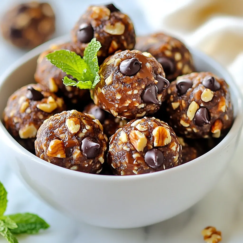 To make mint chocolate chip protein balls, you need a few key items. Gather these ingredients: - 1 cup rolled oats - ½ cup natural almond butter (or peanut butter) - ¼ cup honey or maple syrup - 1 scoop chocolate protein powder - ½ teaspoon peppermint extract - 1/3 cup mini dark chocolate chips - Pinch of sea salt These main ingredients provide a great base for our healthy snack. You can change up your protein balls with some optional ingredients. Here’s what you might add: - ¼ cup chopped walnuts Adding walnuts gives extra crunch and flavor. Feel free to omit them if you want a smoother texture. Each ingredient plays a role in making these protein balls healthy and tasty. Here are some benefits: - Rolled oats are great for energy and fiber. They help keep you full. - Nut butter offers healthy fats and protein. It adds creaminess too. - Honey or maple syrup sweetens naturally, with some vitamins and minerals. - Chocolate protein powder boosts your protein intake, helping muscle recovery. - Peppermint extract gives a fresh flavor, plus it may aid digestion. - Dark chocolate chips add antioxidants and a rich taste. These ingredients combine to create a balanced snack that’s delicious and nutritious. {{ingredient_image_2}} Start by gathering your tools. You need a large mixing bowl, a whisk, and a spatula. Make sure your workspace is clean and organized. This helps keep everything neat while you cook. In your large mixing bowl, add the rolled oats, chocolate protein powder, and a pinch of sea salt. Use your spatula to mix these dry ingredients together. Make sure they are well blended. This step is key to a good texture. In a separate bowl, combine the almond butter and honey (or maple syrup). Use a whisk or fork to blend them until smooth. This mix will add creaminess to your protein balls. Next, add the peppermint extract and blend again. This will give your snack that fresh mint flavor. Pour your wet mixture into the bowl with the dry ingredients. Use your spatula or hands to mix them together. Keep blending until you can no longer see the dry parts. You want everything to be one uniform mix for the best taste. Now it’s time to shape your mixture. Use a tablespoon to scoop out portions. Roll each scoop into a ball with your hands. Place each ball onto a tray lined with parchment paper. This keeps them from sticking and makes clean-up easy. Once all the mixture is shaped, put the tray in the fridge. Let the protein balls chill for at least 30 minutes. This helps them firm up nicely. They will be easier to eat and taste even better after chilling. When choosing protein powder, look for quality. I prefer chocolate protein powder for these balls. Brands like whey or plant-based options work well. Check if they contain minimal additives. To form nice balls, use a tablespoon. Scoop out the mixture firmly. Roll the mixture between your palms. This helps create a smooth surface. Don’t worry about making them perfect; a little shape variation adds charm. You can switch sweeteners based on your taste. Honey gives a rich flavor, while maple syrup adds a hint of earthiness. For lower calories, try agave nectar. Each option changes the taste just slightly. To boost the mint flavor, add more peppermint extract. Start with a few drops and taste. Fresh mint leaves can also add a fresh twist. Chop them finely and mix them in with the other ingredients. Pro Tips Storage Tip: Keep your protein balls in an airtight container in the fridge to maintain freshness for up to a week. Texture Tip: For a chewier texture, use rolled oats instead of instant oats, which can make the balls too soft. Flavor Variation Tip: Experiment with different nut butters, such as cashew or sunflower seed butter, for unique flavor profiles. Protein Boost Tip: Add a tablespoon of chia seeds or flaxseeds to increase the protein and fiber content of your protein balls. {{image_4}} To make nut-free protein balls, swap out the almond butter. Use sunflower seed butter instead. It adds a great taste and keeps the texture creamy. You still get the same yummy flavor without nuts. For a vegan version, replace honey with maple syrup. Use a plant-based protein powder too. This way, everyone can enjoy these tasty protein balls. You won't lose any flavor or fun! You can change the mint taste if you want. Try using vanilla extract instead of peppermint. You could even add a little orange zest for a fruity twist. Get creative! The basic recipe lets you explore many flavors. Store your mint chocolate chip protein balls in an airtight container. This keeps them fresh and tasty. Make sure to line the container with parchment paper. This helps avoid sticking. Place the protein balls in the fridge right after making them. They will firm up nicely in the cool air. If you want to keep them longer, freezing is a great option. First, arrange the protein balls in a single layer on a tray. Freeze them for about an hour. Once firm, transfer them to a freezer-safe bag. This way, you can grab one whenever you want a snack. They will stay fresh for up to three months in the freezer. In the fridge, these protein balls last about one week. Make sure to check for any changes in smell or texture. If they look or smell off, it’s best to toss them. If you freeze them, remember to take them out the night before you want to eat them. Let them thaw in the fridge for a tasty treat! Yes, you can use different nut butters. Almond butter adds a nice flavor. Peanut butter gives a strong taste. Sunflower seed butter works too. Just keep the same amount. To make these protein balls vegan, swap honey for maple syrup. Use a plant-based protein powder. Choose a nut butter that is vegan-friendly. This way, you keep all the taste. You can use vanilla protein powder instead of chocolate. The flavor will change a bit. You might want to add cocoa powder for more chocolate taste. Adjust the sweetness if needed. Yes, these protein balls are gluten-free. Just make sure to use certified gluten-free oats. This helps anyone with gluten allergies enjoy them too. To boost nutrition, add chia seeds or flaxseeds. Both are rich in fiber and omega-3s. You can also mix in some dried fruit for extra vitamins. You now have a clear guide to making tasty protein balls. We covered main and optional ingredients, plus their benefits. You'll find step-by-step instructions for easy prep, mixing, and chilling. I also shared helpful tips for shaping and flavoring. Variations, storage tips, and FAQs offer extra help for all diets. Feel free to experiment with flavors and ingredients to suit your taste. Enjoy making and sharing these healthy snacks!